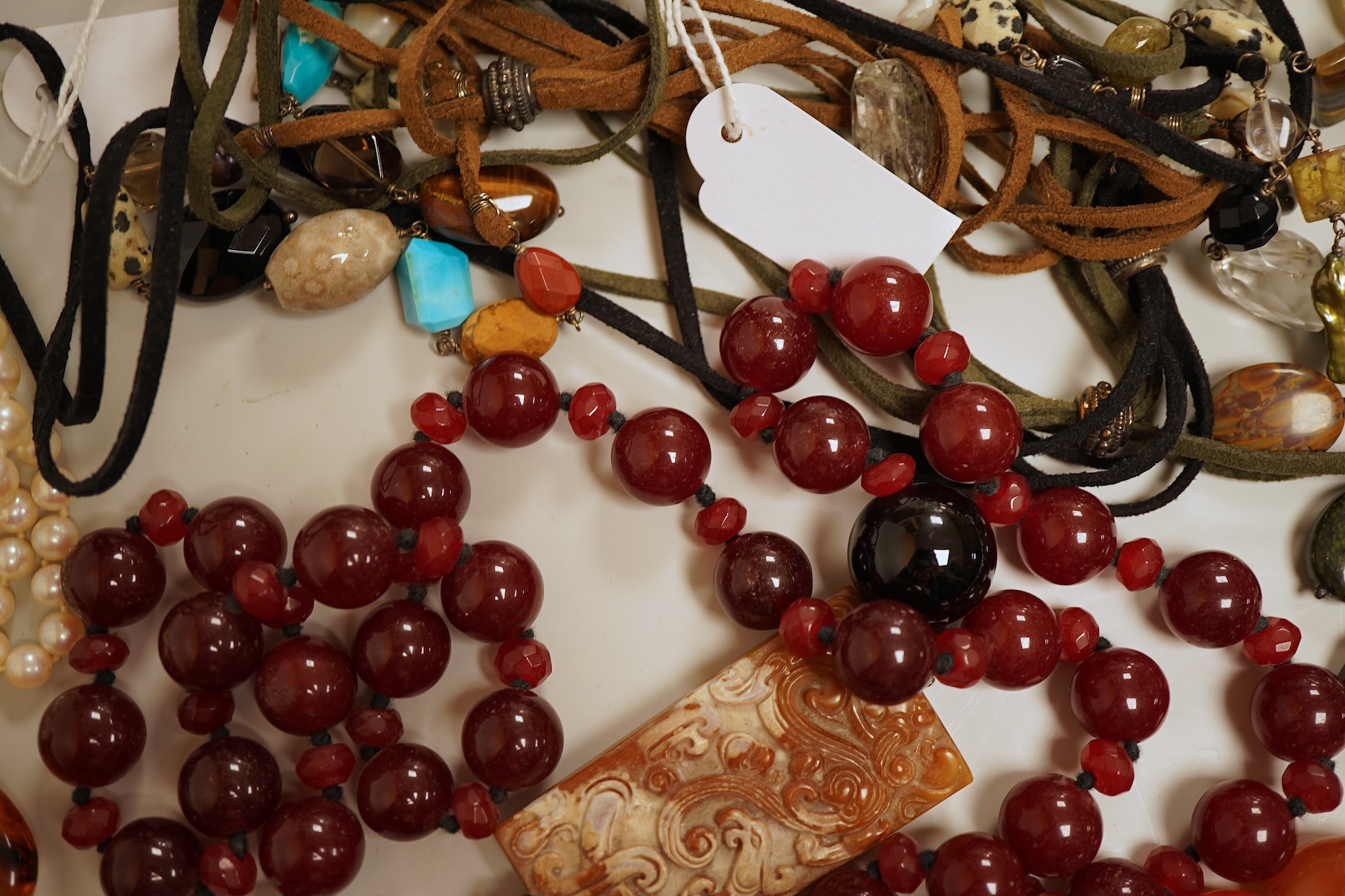 A collection of cultured pearls and hardstone jewellery, comprising: a cultured pearl necklace with a cultured pearl and diamond clasp in 18ct gold, length 46cm, British hallmarks; a cultured pearl necklace with a gold b